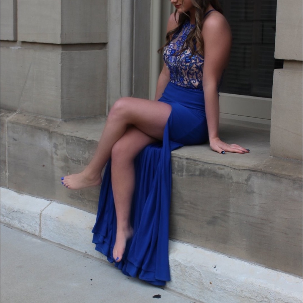 Royal blue prom dress with slit and embroidery.
